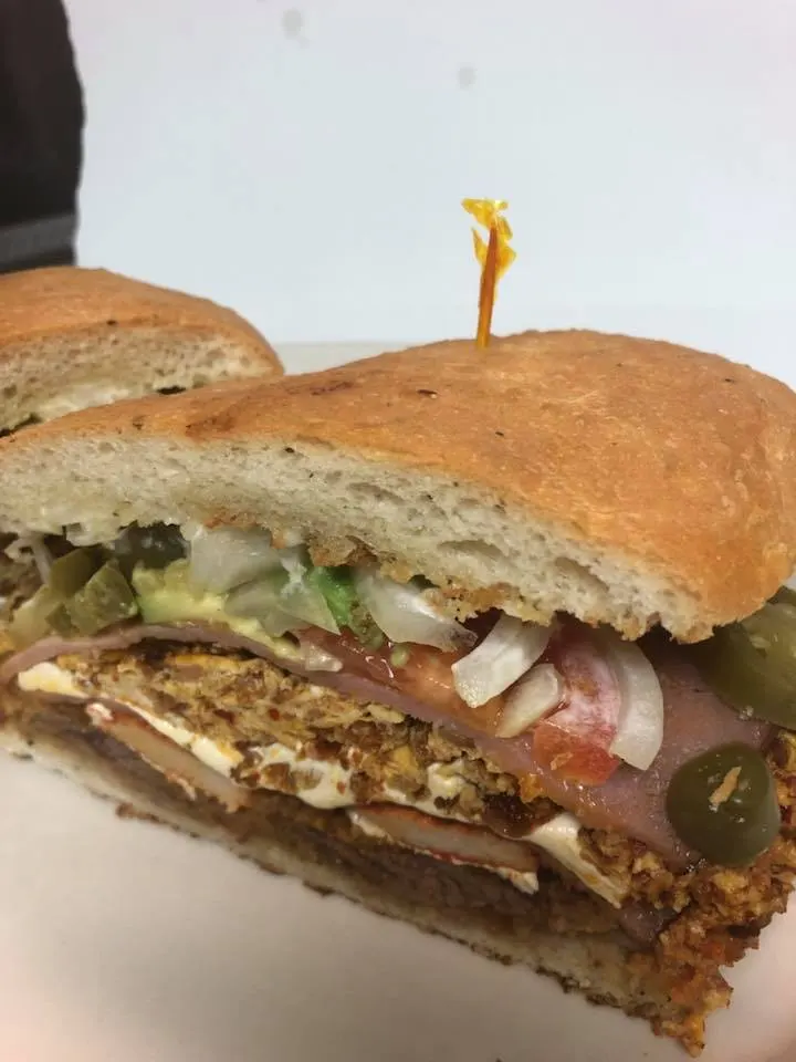 A cheesesteak on a roll